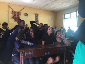 Haben sitting with the students at the Victory School for the Deaf.