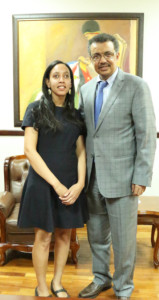 Haben and Dr. Tedros posing in front of painting at Ministry of Foreign Affairs.